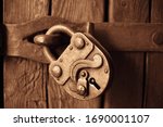 Old Lock Hanging On Wooden Door....