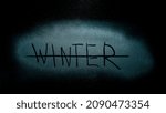 Small photo of Winter season. blue Frozen glass lettering. Winter word on frozen window surface. end of winter. strikethrough word. night scene