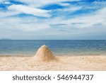 Small photo of Beautiful tropical beach and sea with white sand castle,cloud and blue sky background