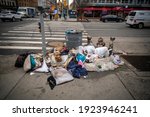 Small photo of New York NY USA-February 23, 2021 A fine selection of garbage from an overflowing street trash receptacle in New York