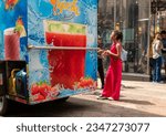Small photo of New York NY USA-August 12, 2023 Food cart selling juices and smoothies in the Herald Square shopping district in New York