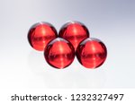 Small photo of Small red medicine capsules containing nitroglycerin, validol