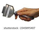 Small photo of groomer, hand holding wool comb, hand comb or Slicker brushes for grooming pet hair isolated on white background. holding a groomer tool