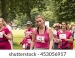 Small photo of Liverpool, UK - June 26, 2016: Race for Life sponsored fun run for British charity Cancer Research UK. Looking worse for wear, a tired runner - Editorial