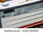Small photo of St. Michaels, Maryland, USA-June 17, 2023: The brand script on an antique Lyman runabout boat at the annual Antique and Classic Boat Festival.