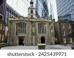 Small photo of London, UK, January 20, 2024. St Helen's Church, Bishopsgate, an Anglican Church dating back to the 12th Century, with The Gherkin skyscraper behind.