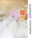 Small photo of purple dotty socks and flowers on white gown