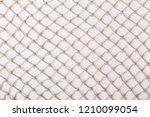 Small photo of Fishnet on white background. Fishing net. Texture fish