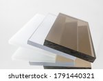 Small photo of Solid Polycarbonate Sheet. Brown, white, transparent. Acrylic Plastic glass