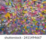 Small photo of A rainbow of post-it notes adorned the wall, each holding snippets of ideas and tasks in a colorful mosaic.