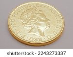 Small photo of Gold coin 100 pounds, bullion coin. Elizabeth II Dei Gratia Regina Fidei Defensatrix