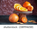Small photo of Orange fruit with green leaves on the white wood. Home gardening. Mandarine oranges. Tangerine oranges. Orange color. Fresh orange juice, Mandarin Oranges Slice Flatlay on a Marble Background.