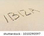 Ibiza Text Written In The Sand. ...