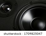 wooden multimedia speaker system over black background. professional audio stereo system