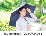Asian Woman With A Parasol