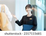 Small photo of Hotel staff showing guests around