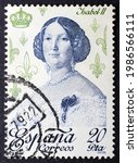 Small photo of MADRID, SPAIN - JUNE 5, 2021. Vintage stamp printed in Spain shows Isabella II of Spain (1830 - 1904), also known as the Queen of Sad Mischance, was Queen of Spain from 1833 until 1868