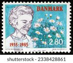 Small photo of MADRID, SPAIN - JULY 27, 2023. Vintage stamp printed in Denmark shows 50th Anniversary Queen Ingrid's Arrival to Denmark. Ingrid of Sweden (1910 - 2000), Queen of Denmark from 1947 until 1972