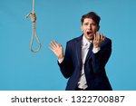 Small photo of A business man in a suit stands next to a rope with a loopback credit depression
