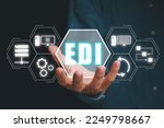 EDI, Electronic data interchange concept, Person hand holding Electronic data interchange icon on virtual screen.