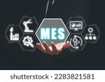 Small photo of MES - Manufacturing Execution System concept, Businessman hand holding Manufacturing Execution System icon on virtual screen.