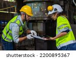 Two engineers in a steel mill Consult the size of the steel workpiece. Bring the workpiece to assemble the locomotive.