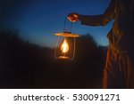 Man Holding The Old Lamp With A ...