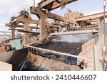 Small photo of Sand quarry banner, Industrial plant with belt conveyor in open pit mining. Construction site, Industry machine for stone crusher.