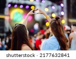 Small photo of Heart shaped hands at concert, loving the artist and the festival. Music concert with lights and silhouette of people enjoying the concert.