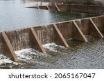 Small photo of The water flow pass the weir from upper level to lower level.