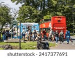Small photo of Bristol, UK- August 15, 2023: Ice cream truck serving locals and tourists in Clifton Bristol with Toot bus.