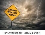 Sign with words 'Stormy weather ahead' on a background of thunderclouds with lightnings