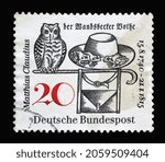 Small photo of ZAGREB, CROATIA - JUNE 27, 2014: Stamp printed in Germany dedicated to Matthias Claudius (1740–1815), Poet and Editor of the Wandsbecker Bothe. Owl, Frogs, Hat and Satchel, circa 1965