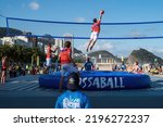 Small photo of Copacabana Beach, Rio de Janeiro, Brazil - 10 August 2016. A professional team of bossaball players show their skills to tourists on Copacabana Beach in the most colorful ball game ever. The game is a