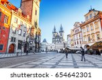 Classical view at Old Town Hall,  Central Town Square and Church of Lady Tyn in Prague city. Astronomical clock visible. Iconic travel destination. Clear morning sunny scenery.