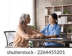 Small photo of Young asian woman or nurse care hand on senior grandmother shoulder give support empathy to elderly lady or older people in assisted care mental health sick relief concept hand clasp to encourage