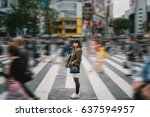 Portrait girl crossing busy city street/ Girl Crossing Street/ Girl crossing street in Tokyo, Japan