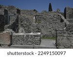 Roman ruin of streetside shop at Pompeii