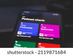 Small photo of Riga, Latvia - 2022, February 2:Podcasts charts on spotify. Podcast listening platform. A podcast is an episodic series of digital audio files that a user can download to a personal device for easy l