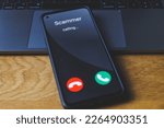 Small photo of Phone call from scammer. Incoming scam call concept. High quality photo
