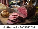 sliceing roasted eye of round beef with knife