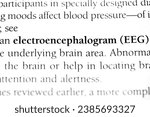 Small photo of electroencephalogram or EEG, medical diagnosis tool to test or scan brain waves, printed in black on white page of book