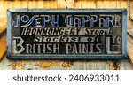 Small photo of Rabat, Malta - 22 December, 2023: vintage store sign of an ironmonger in the historic city center of Rabat