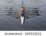 rowers paddling in a beautiful italian lake