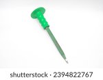 Small photo of Green corroded chisel on white background. A chisel is a carpentry tool in the form of an iron blade that is sharp at the end to make holes or carve hard objects such as wood, stone or metal.