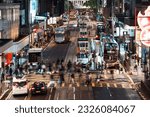 Small photo of Central, Hong Kong - Jun 6, 2023: Motion blur of Chinese people, crowd Asian commuter walk cross road, car, bus, taxi traffic transportation at night. Asia transport lifestyle, urban city life concept
