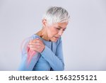 Small photo of Senior woman with shoulder pain. Elderly woman is enduring awful ache. Shoulder Pain In An Elderly Person. Senior lady with shoulder pain