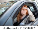 Small photo of Nervous female driver sits at wheel, has worried expression as afraids to drive car by herself for first time. Frightened woman has car accident on road. People, driving, problems with transport