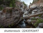 Small photo of Large boulder and Paulina Creek Falls, Oregon