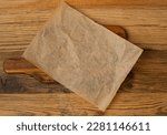 Brown Baking Paper, Kraft Cooking Paper Sheet Texture Background, Bakery Parchment Mockup, Greaseproof Material, Baking Paper on Wood Background Top View with Copy Space